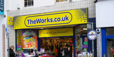 People shopping at TheWorks.co.uk, a gift shop offering toys, games, and festive deals in a UK high street location